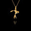 Sterling silver swallow pendant with gold-plated body and rhodium-plated accent, showing the bird with outstretched wings in a mid-flight pose, hanging on a gold chain against a black background.