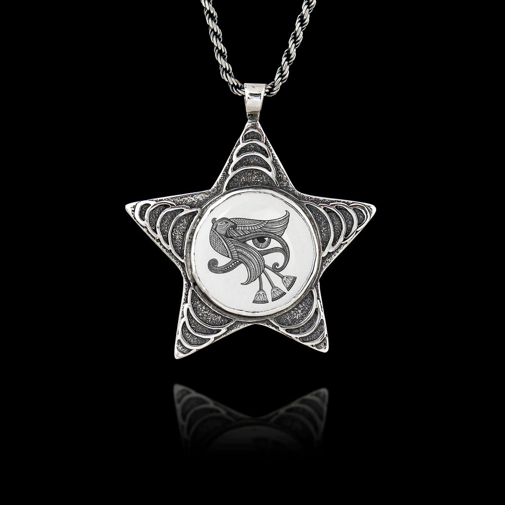 925 sterling silver five-pointed star pendant featuring a round ceramic insert with the Egyptian Eye of Ra symbol.