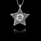 925 sterling silver five-pointed star pendant with spiral details featuring a round ceramic insert with the Sanskrit Om symbol.