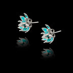 Side view of the flower enamel studs showing the polished silver setting and secure post fastening.
