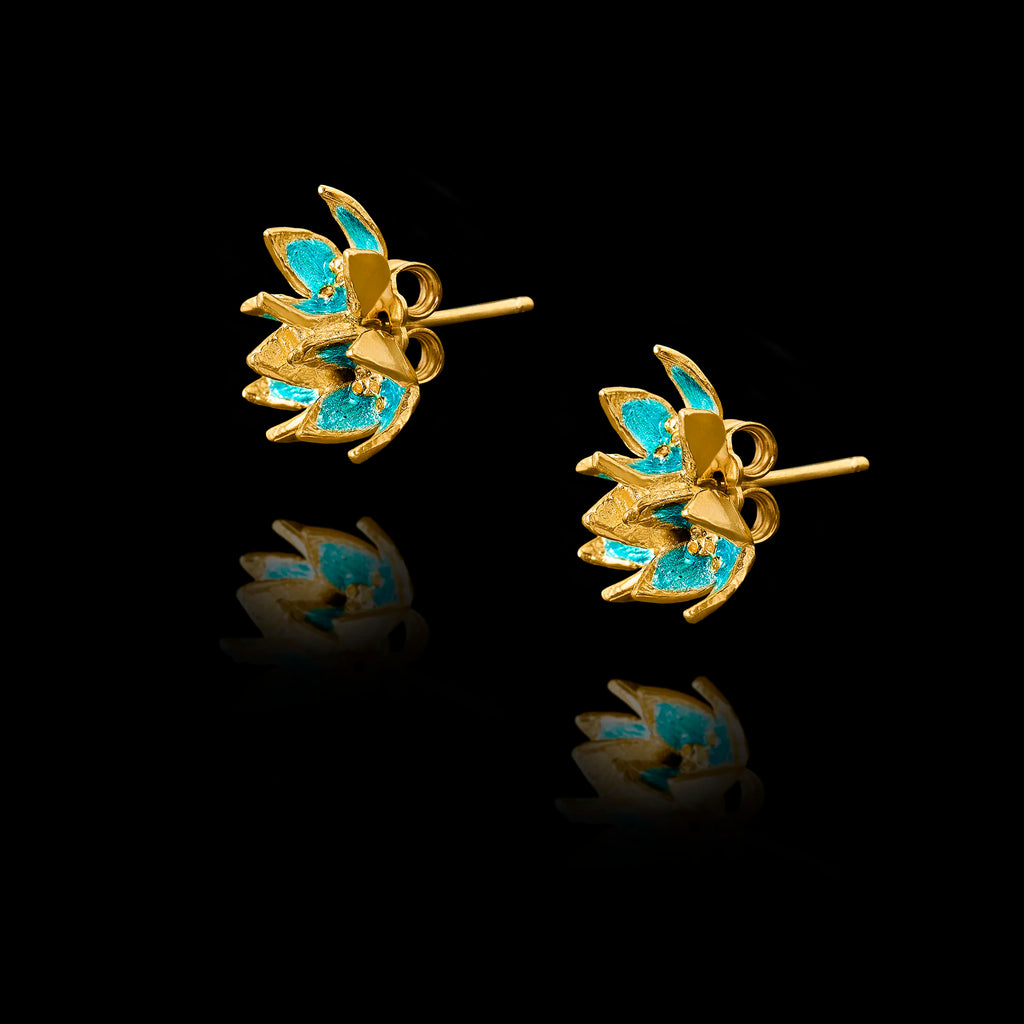 Side view of the flower enamel studs showing the polished gold setting and secure post fastening.