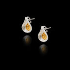 Perspective view showing the detailed texture and secure stud fastening of the silver and gold fig earrings.