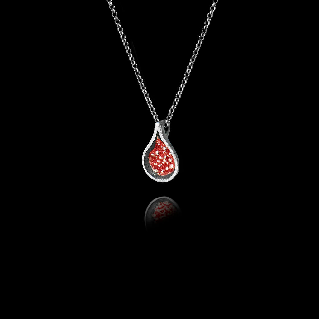 Side angle view of a 925 sterling silver fig pendant showing the teardrop oxidised silver frame and red enamel cross-section detail with silver seed granules on a silver chain against a black background.