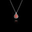 925 sterling silver fig pendant with oxidised silver teardrop frame and vivid red enamel interior with tiny raised silver granule seeds, hanging on a silver chain against a black background.