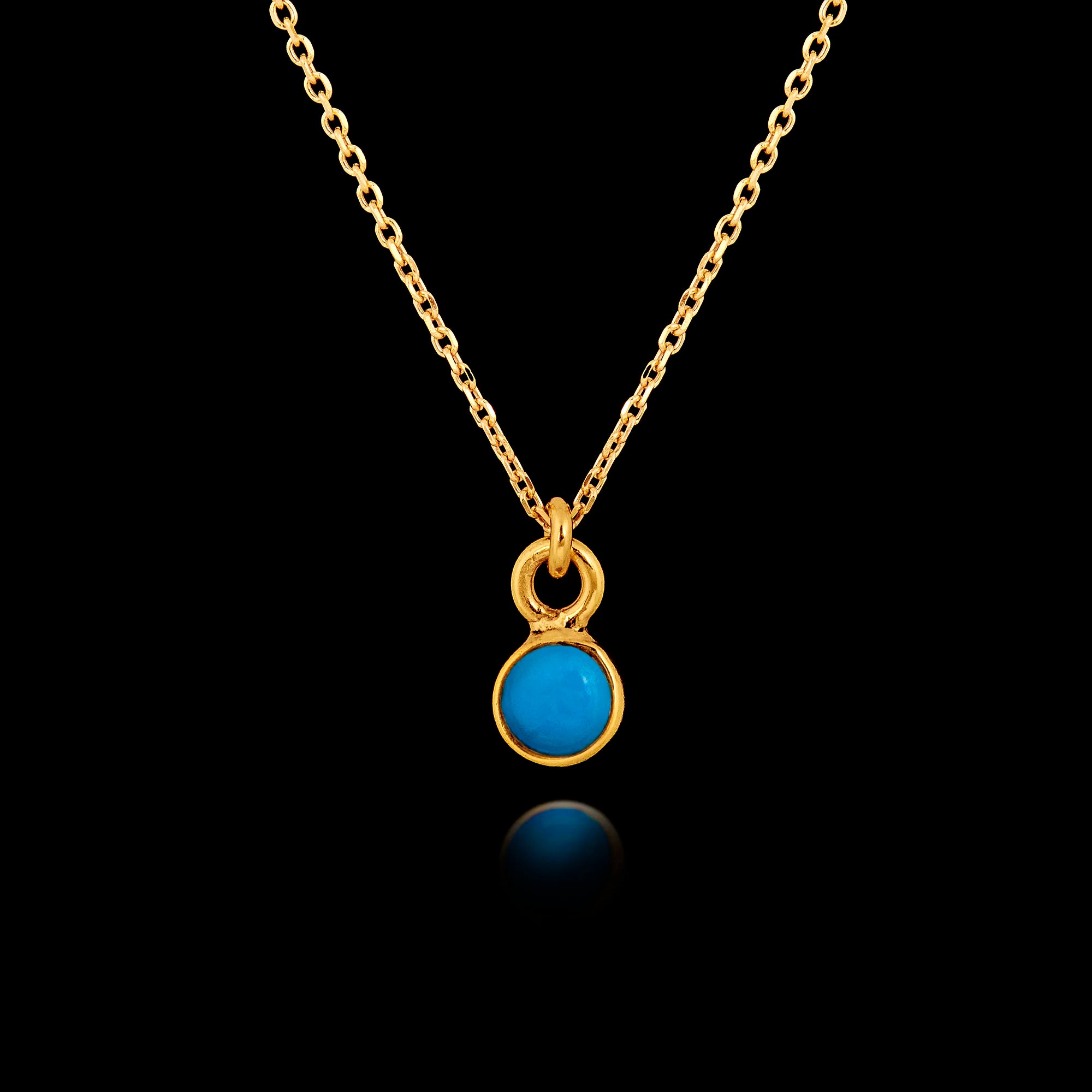 Gold plated 925 sterling silver pendant necklace featuring a round 5mm smooth turquoise gemstone in a bezel setting on an adjustable chain.