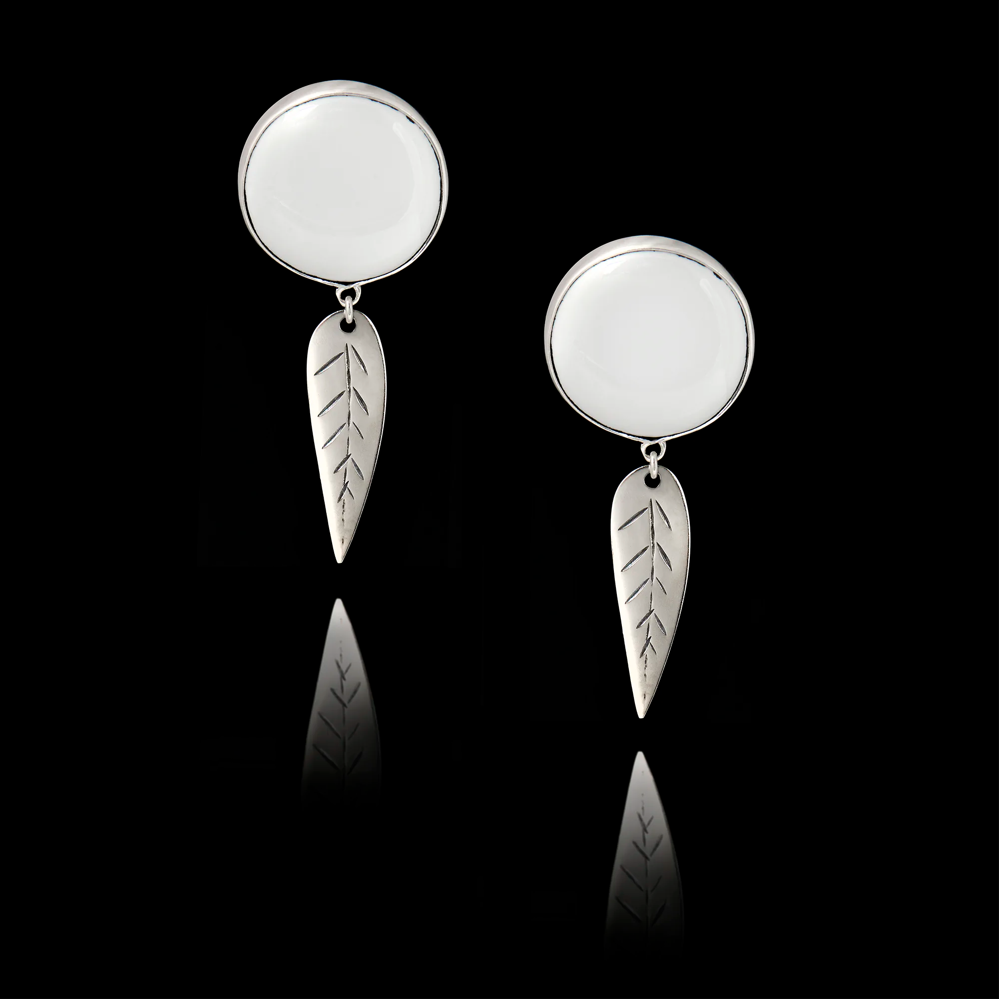 Pair of 925 sterling silver drop earrings featuring engraved silver leaf dangles and blank white ceramic inserts ready for custom printing.
