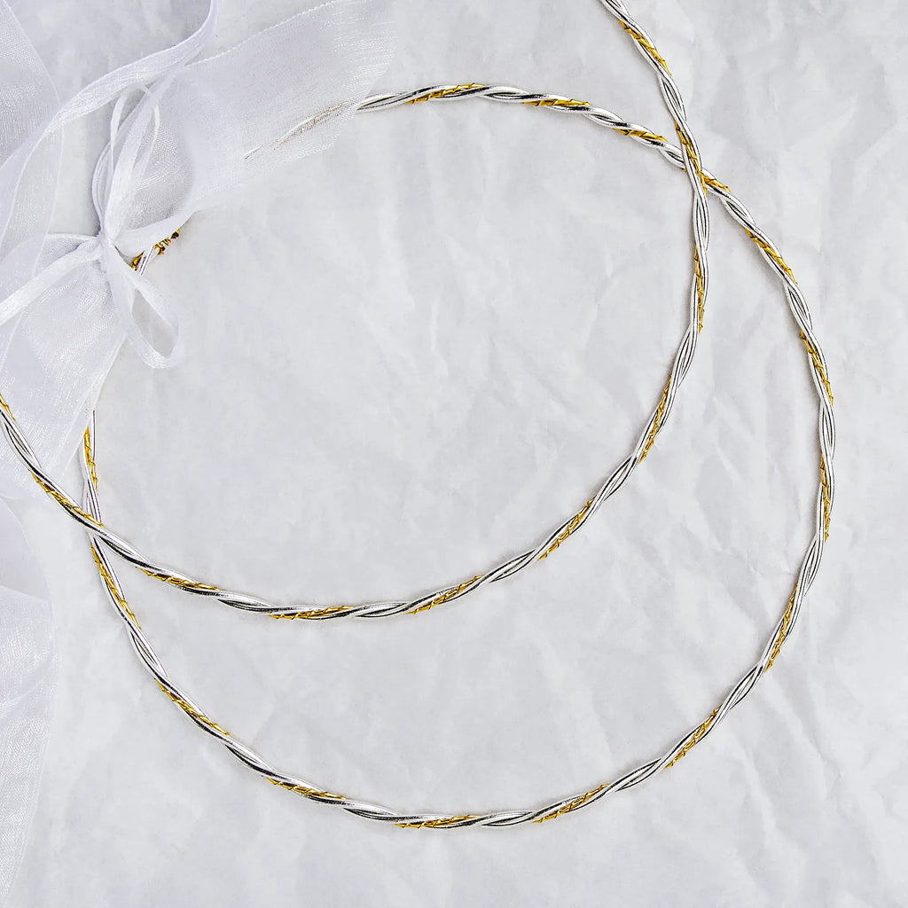 Full view of handmade two-tone wedding crowns featuring silver rope design and gold twisted wire.