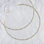 Full view of handmade two-tone wedding crowns featuring silver rope design and gold twisted wire.