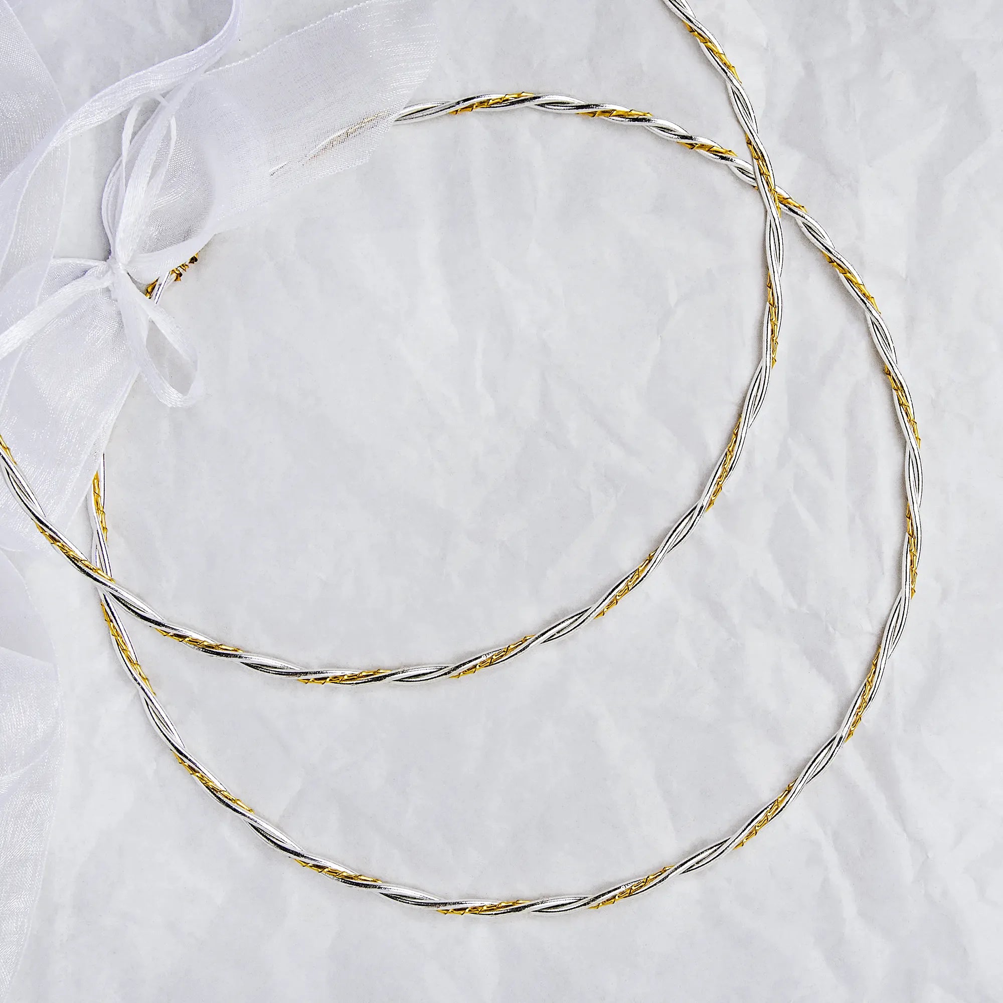 Full view of handmade two-tone wedding crowns featuring silver rope design and gold twisted wire. Main image