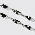 Close-up detail of the intricate dual-twisted sterling silver design, showing the play of light on the silver ribbon.